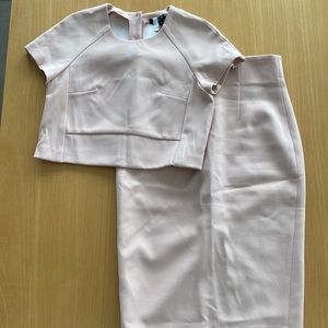 Femme Carriere dust pink skirt suit.